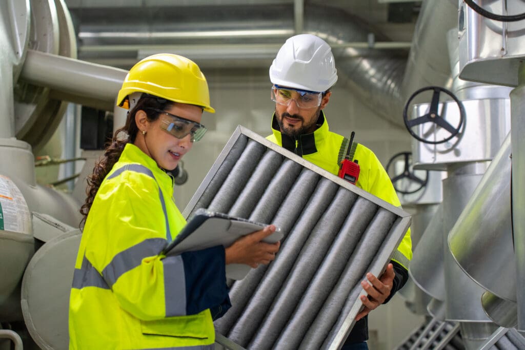 Facilities manager and engineer reviewing a data driven maintenance platform dashboard together